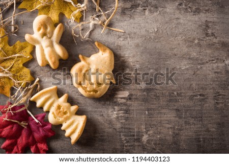 Homemade Halloween cookies on wooden table background. Top view. Copyspace