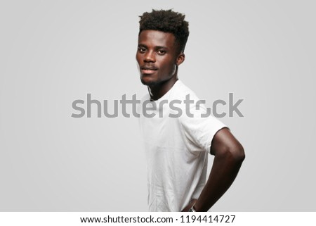 young cool black man sign. cut out person against monochrome background