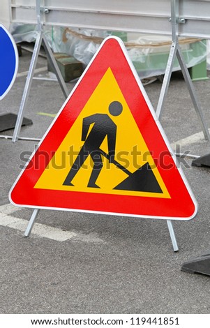 Road works triangular traffic sign at construction site
