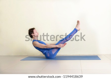 woman in the Studio doing yoga corner