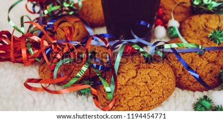 New Year and Christmas. Serpentine and garlands. Ginger and oatmeal cookies. New Year sweets. White background. Hot coffe in dark cup.