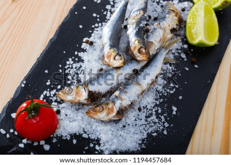 Picture of  deliciously dish of anchovy baked in the oven on a pillow of sea salt