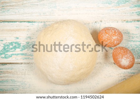 pizza dough and other products are on the table