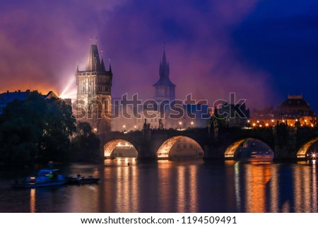 Night time hazy smoke over the charles bridge in prague after fireworks