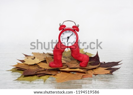 Daylight Saving Time. Wall Clock going to winter time. Autumn abstraction. Fall back time. Royalty-Free Stock Photo #1194519586