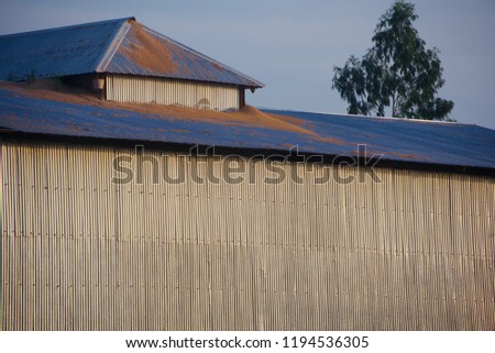 A high tin shed roof top of a traditional building unique photo