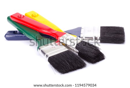 Four new colorful paint brushes with wooden handles