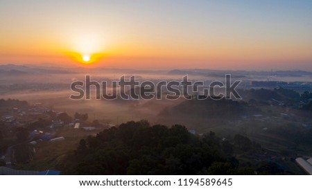Morning mist with mountain at sunrise.In industrial estates Mado, Pictures from Dorn