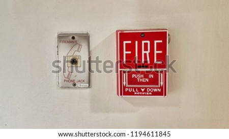 Red Fire alarm and emergency phone on the wall