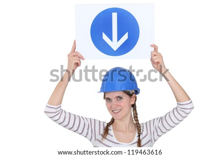 Woman holding a road sign