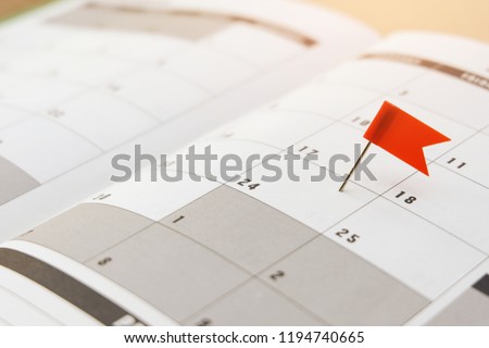 Stack of coins on a calendar sheet for saving money to finance business investment fund - finance saving concept. Royalty-Free Stock Photo #1194740665