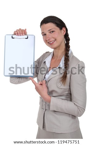 Woman pointing to blank clip-board