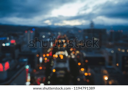 Abstract of night view blurred Cityscape of building and traffic light at night time background