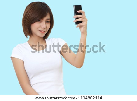 beautiful young asian woman holding smart phone on hand