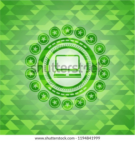 laptop icon inside green mosaic emblem