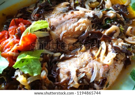 Fish soup Vietnamese traditional food with tomato mushroom fresh fish onion chillies chicken stock
