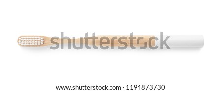 Toothbrush made of bamboo on white background, top view Royalty-Free Stock Photo #1194873730
