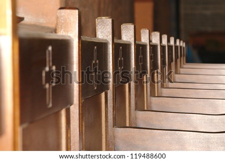 horizontal picture of rows of wooden church pews