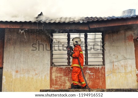 firefighter extinguishes a fire