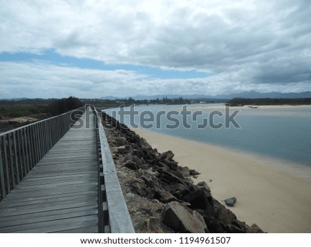 Old wooden boardwalk nearby the ocean in Urunga, NSW, Australia