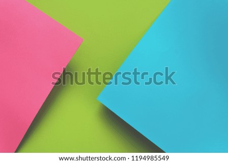 Blue, green and pink pastel colored paper background. Volume geometric flat lay. Top view. Copy space. Toned
