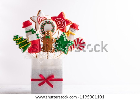 Set of Christmas gingerbread on sticks in a gift box. Christmas concept with copy space.