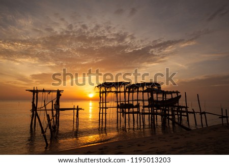 Beautiful silhouette sunrise at tropical sea