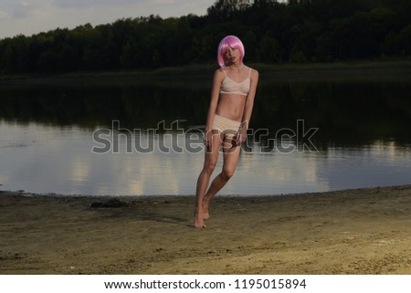 girl with pink hair jumping and posing