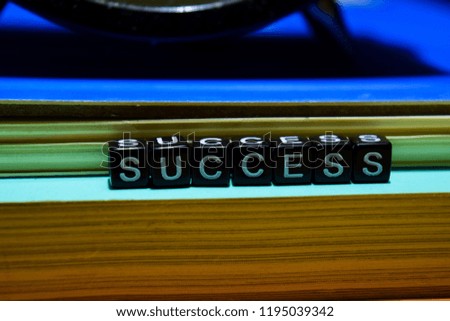 Success on wooden blocks. Education and business concept on wooden background