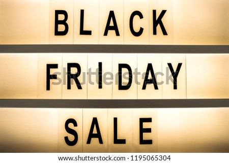 Black friday sale concept. Fourth Friday of November, beginning of Christmas shopping season since 1952. Glowing lightbox with promo text. Background, copy space, close up, top view, flat lay