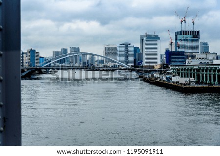A View of Tokyo Japan Skyline from a Bridge across a River