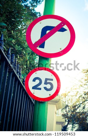 Road sign indicating 25 mph speed limit and "do not turn right"