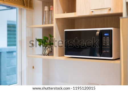 microwave in the kitchen  Royalty-Free Stock Photo #1195120015
