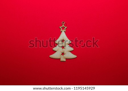 Christmas wooden toy Christmas tree on a red background