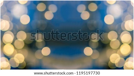 Abstract yellow blue light bokeh background for Christmas, Birthday anniversary refocused vintage blurred background. 