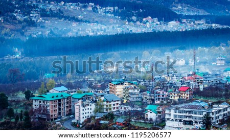 Aerial  view of Manali city in India from the  Mountain Royalty-Free Stock Photo #1195206577