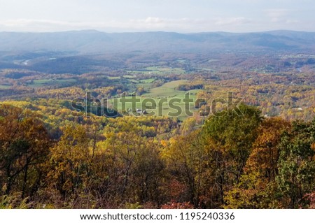Aerial view of the Shenandoah Valley mountains covered by forests in bright autumn colors