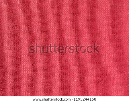 Red paper texture useful as a background, soft pastel colour