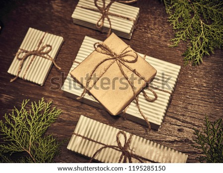Christmas composition. Christmas gifts, pine branches, toys on wood background. Flat lay, top view