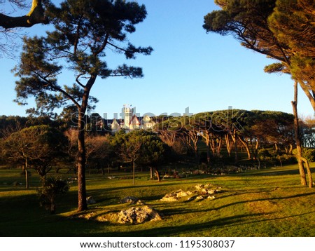 Palace of La Magdalena surrounded by pine tree woods atop of rocky cliff in Santander, Spain.
