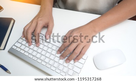Man's hands typing on  keyboard