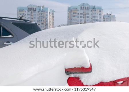 
Red car in the snow