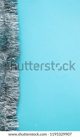 Christmas garland on blue background. Winter holiday banner.