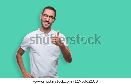 Happy young man doing a gesture of okay