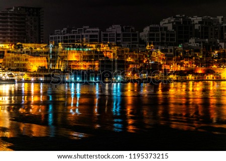 Merged photo: Valletta and modern buildings.