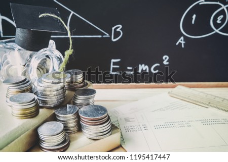 Fund for Education concept. mortar board on bottle and coins stack and  formula in chalkboard background. Education. Classroom. school.