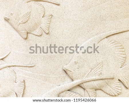 Low relief cement Thai style handcraft of fish