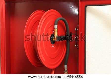 The fire host cabinet in the building, in concept of fire fighting, prevention, safety equipment.