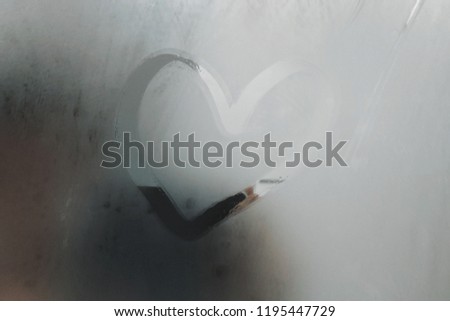 Drawing heart on steamy mirrors.