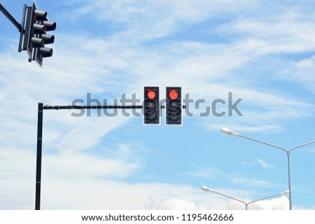 traffic lights with blue sky background